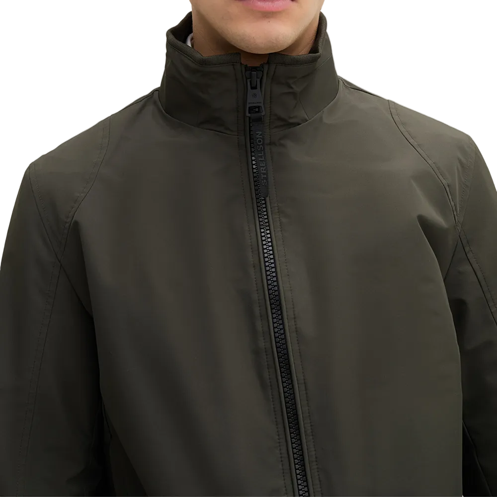 Man wearing Strellson Lucca Windbreaker Jacket in olive with stand collar and zip front, and embroidered logo on the left arm, Kayagan