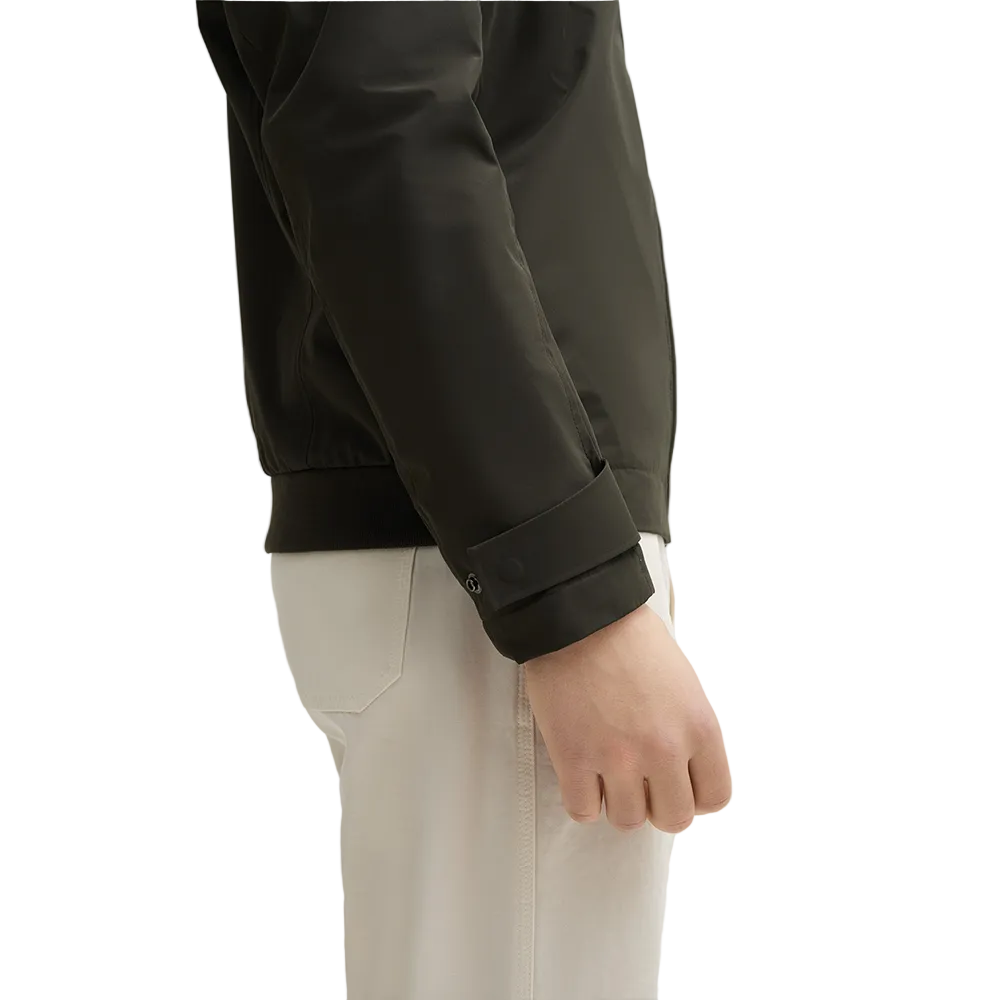 Man wearing Strellson Lucca Windbreaker Jacket in olive with stand collar and zip front, and embroidered logo on the left arm, Kayagan