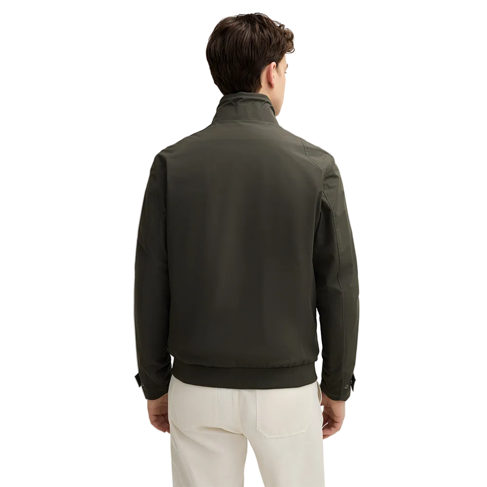 Man wearing Strellson Lucca Windbreaker Jacket in olive with stand collar and zip front, and embroidered logo on the left arm, Kayagan
