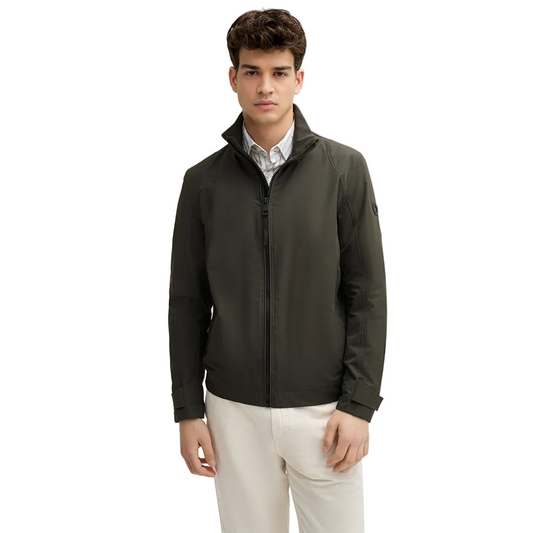 Man wearing Strellson Lucca Windbreaker Jacket in olive with stand collar and zip front, and embroidered logo on the left arm, Kayagan